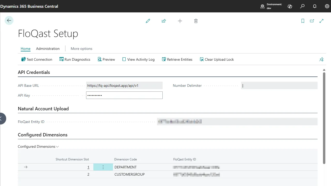 FloQast Setup page in Business Central with API credentials and a table mapping shortcut dimension slots to FloQast entity IDs.