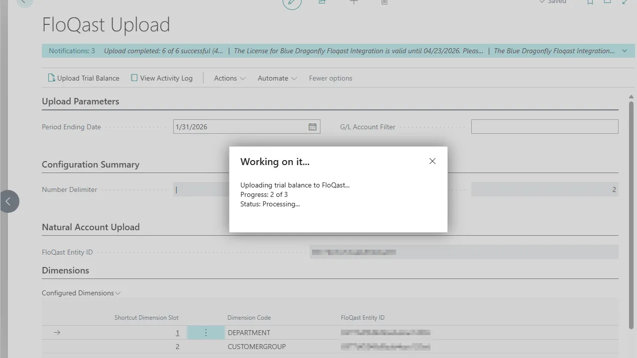FloQast Upload page with a 'Working on it' progress dialog showing upload progress and a completion notification banner.