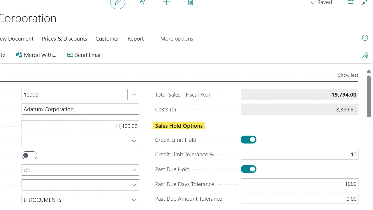 Business Central customer card with a Sales Hold Options panel showing Credit Limit Hold and Past Due Hold toggles, tolerance %, and day and amount thresholds.