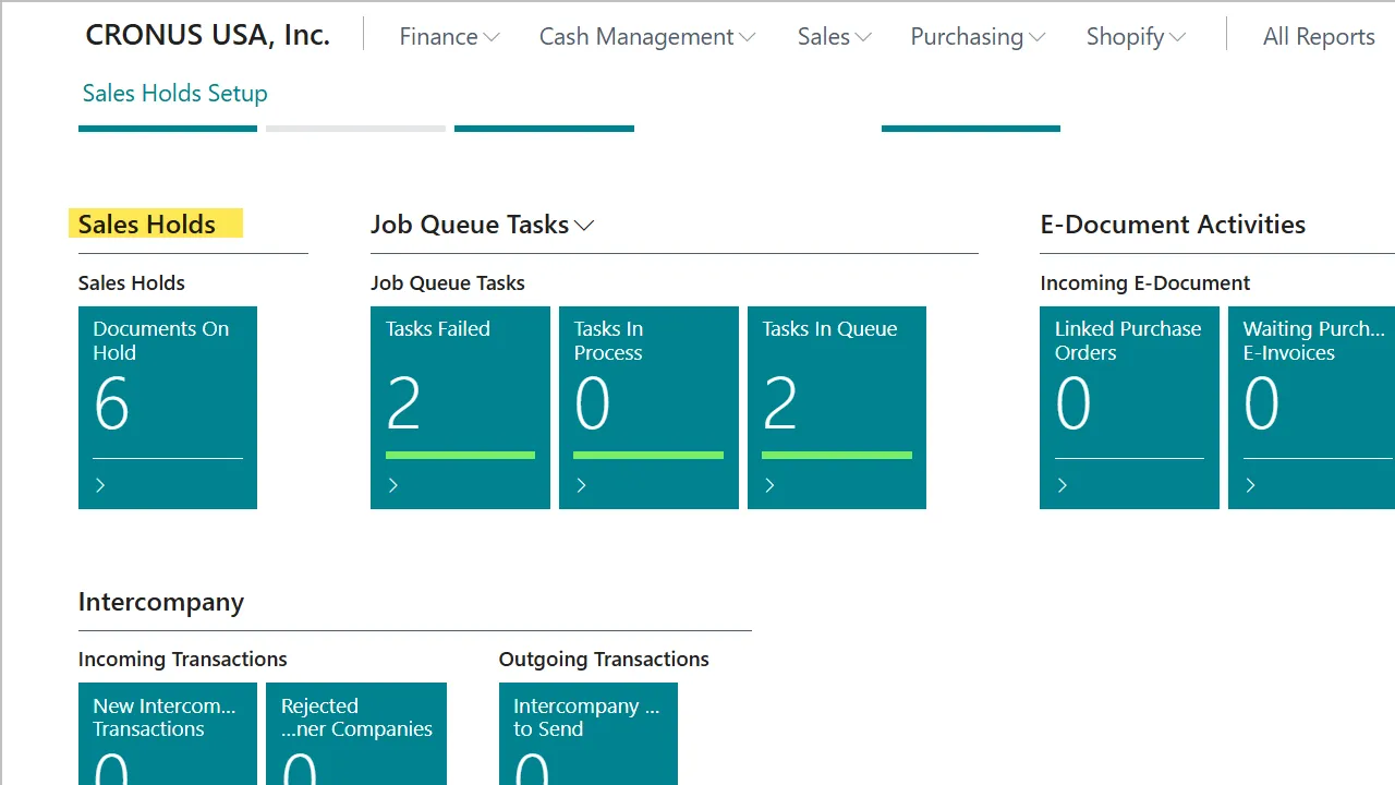 Business Central role center showing a 'Sales Holds — Documents On Hold' cue with count of 6, alongside Job Queue Tasks and E-Document Activities cues.